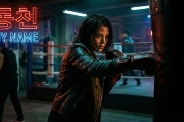 Han So-hee as Yoon Ji-woo punching a heavy bag in a gritty, neon-lit gym scene from the Netflix KDrama "My Name"